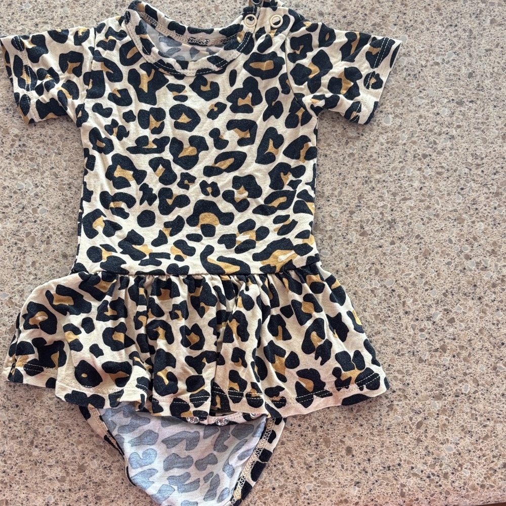 Posh Peanut Leopard Print Baby Skater Romper in Cream, Black & Gold